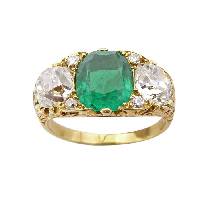 Emerald and diamond three stone ring